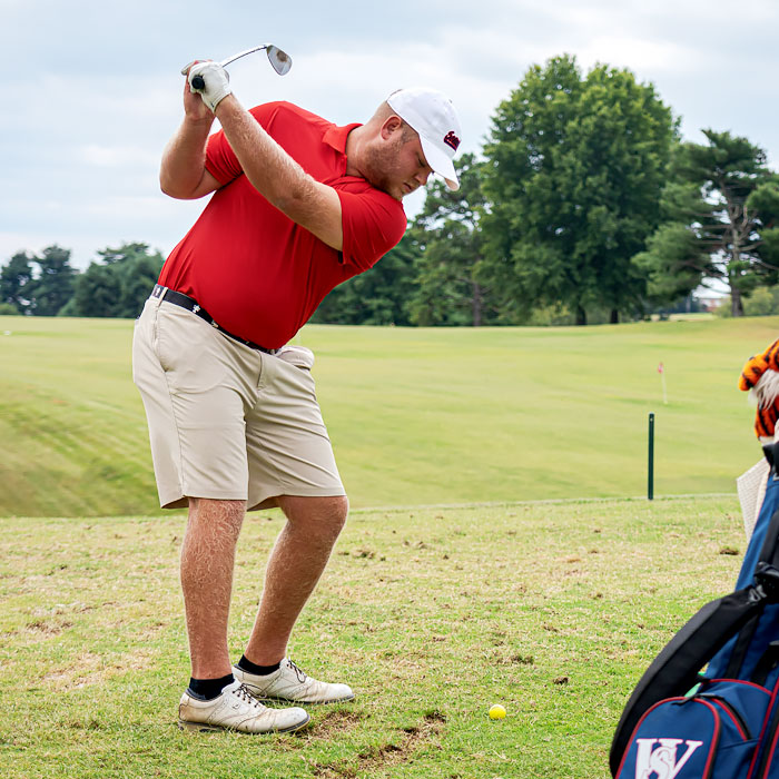 A golfer swinging a club A golfer swinging a club