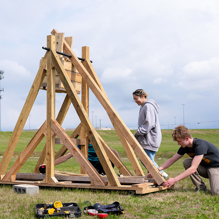 Students assembling a trebuchet Students assembling a trebuchet